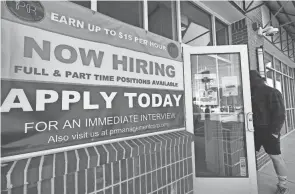  ?? ELISE AMENDOLA/AP ?? The strong jobs report could complicate President Joe Biden’s struggle to push through his $1.9 trillion COVID-19 relief package, though Senate approval was expected this weekend.