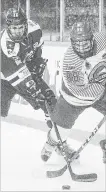  ?? BOB TYMCZYSZYN ST. CATHARINES STANDARD ?? St. Catharines Falcons Jaleel Adams (98) handles the puck behind the Ancaster Avalanche net in Game 1 of their Greater Ontario Junior Hockey League semifinal Friday night.