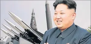  ?? AP FILE PHOTO ?? North Korean leader Kim Jong-un is shown is this recent file photo applauding while reviewing missiles being developed for a possible long-range attack against the U.S..