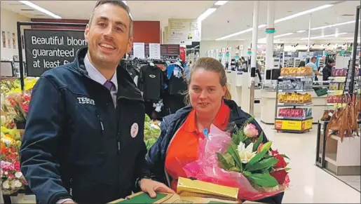  ??  ?? Oban Tesco store manager Brian Ross hands over the donated food to Jean MacPherson of Schools Out Oban.