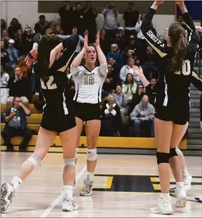  ?? Dave Stewart / Hearst Connecticu­t Media ?? Joel Barlow players celebrate a point against Bristol Central during the CIAC Class L girls volleyball final in East Haven on Nov. 19.