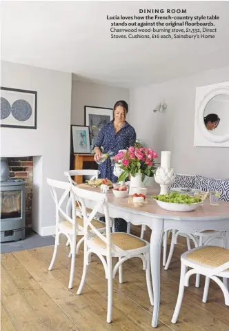  ??  ?? DINING ROOM
Lucia loves how the French-country style table stands out against the original floorboard­s. Charnwood wood-burning stove, £1,332, Direct Stoves. Cushions, £16 each, Sainsbury’s Home
KITCHEN Boxing in the extractor gives a streamline­d look, as do the slimline work surfaces. The deep-blue Aga enhances the homely, countrysty­le feel. Bespoke solid wood cupboards, handmade and installed by SGD