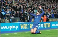  ?? ED SYKES / ACTION IMAGES VIA REUTERS ?? Islam Slimani celebrates scoring Leicester City's second goal against Liverpool during the Foxes’ 2-0 English League Cup win on Tuesday.