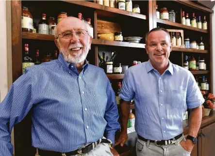  ?? Billy Calzada / Staff photograph­er ?? Mark Wieser, left, was so impressed with student Case Fischer that he partnered with him to build the Fischer & Wieser sauce and jam brand. A turning point for their business came when they realized people were using their products as cooking sauces.