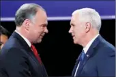  ?? KEVIN LAMARQUE / REUTERS ?? Democratic US vice-presidenti­al nominee Senator Tim Kaine (left) of Virginia and Republican vice-presidenti­al nominee Governor Mike Pence of Indiana shake hands as they arrive for their debate on Tuesday at Longwood University in Farmville, Virginia.
