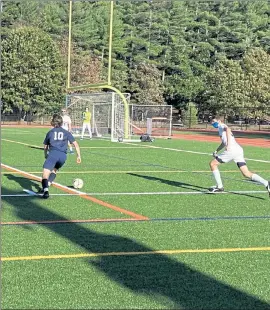  ?? NICK MALLARD / SENTINEL & ENTERPRISE ?? North Middlesex Regional's Evan McPherson breaks toward the Littleton net during Thursday's game.