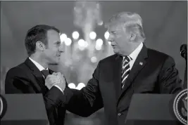  ?? ASSOCIATED PRESS ?? shake hands during a joint news conference in the East Room of the White House in Washington on Tuesday.