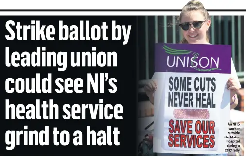  ??  ?? An NHS worker outside the Mater Hospital during a 2017 rally