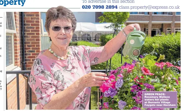  ??  ?? GREEN PEACE: Rosemary Wallace waters her plants at Durrants Village Faygate near Horsham