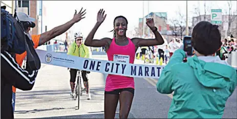  ?? Special to the Democrat-Gazette/ALEXANDRIA WILLIAMS ?? Sika Henry (center), is shown a moment before winning her second consecutiv­e Newport News One City Marathon in Newport News, Va., in March 2016.