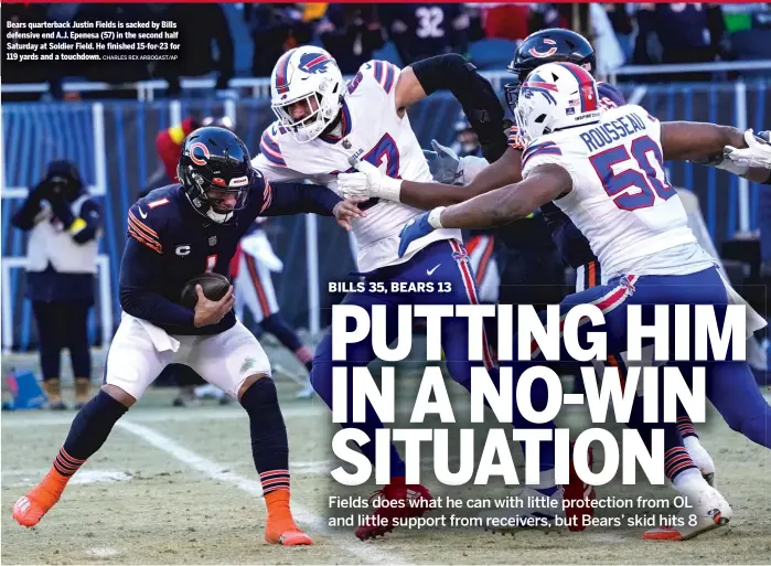  ?? CHARLES REX ARBOGAST/AP ?? Bears quarterbac­k Justin Fields is sacked by Bills defensive end A.J. Epenesa (57) in the second half Saturday at Soldier Field. He finished 15-for-23 for 119 yards and a touchdown.