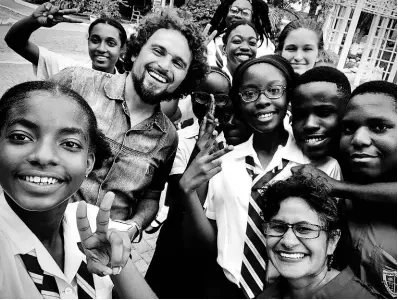  ?? VIA INSTAGRAM @DAVIDCAIRO­L ?? Cairol poses with students of Campion College in 2020. The musician taught the students the basics of music compositio­n and improving their songwritin­g skills.