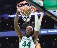  ?? Mary Schwalm / Associated Press ?? Celtics center Robert Williams III dunks against the Suns on Friday.