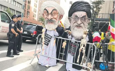  ?? Picture: Reuters ?? People dressed as Iran’s Supreme Leader Ali Khamenei and Iranian President Hassan Rouhani protest in New York in the US on Monday.