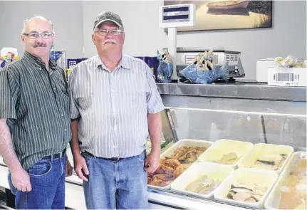  ?? CAPE BRETON POST ?? Bonnar’s Meats owner Albert Bonnar, left, and employee Ronnie Gardiner stand at the corner of their store in 2017. The Northside shop will be celebratin­g 26 years in business in May.