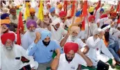  ?? — PTI ?? Farmers raise anti-government slogans during a protest in Amritsar on Monday.