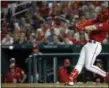  ?? ALEX BRANDON - THE ASSOCIATED PRESS ?? In this June 8, 2018, file photo, Washington Nationals’ Bryce Harper hits a two-RBI double during the fifth inning of a baseball game against the San Francisco Giants at Nationals Park in Washington. Harper, Manny Machado, Craig Kimbrel and Dallas Keuchel will not be around when the bat and ball bags are opened at spring training throughout Florida and Arizona this week. They are among the dozens of free agents still looking for jobs.
