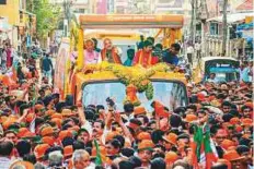  ?? PTI ?? BJP president Amit Shah and other officials travel in a convoy during campaignin­g in Mangaluru.