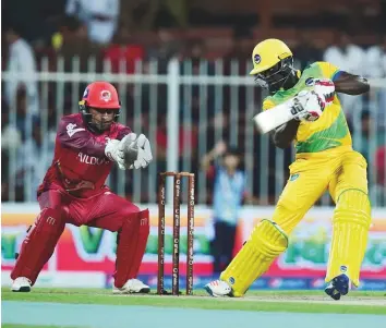  ?? Atiq Ur Rehman/Gulf News ?? Andre Fletcher of Pakhtoons cuts one to the fence against Sindhis during a T10 League match ■ at the Sharjah Cricket Stadium yesterday. He scored an unbeaten 68.