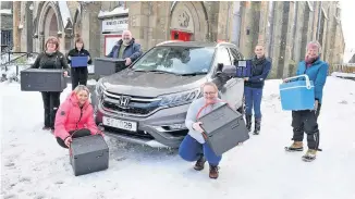  ??  ?? Helping hand From left, Nan Cook, Kinross Centre manager; Isobel Gardner, Glen Douglas, Yvonne Cook, and volunteer Ailsa Smith. Front, Laura Beverage and Jo McLaughlin