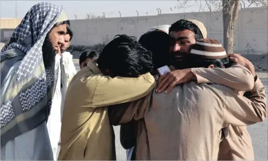  ?? Picture: AP ?? Pakistani family members of attack victims mourn outside the police training school which was attacked by IS militants in Quetta, Pakistan, on Monday.