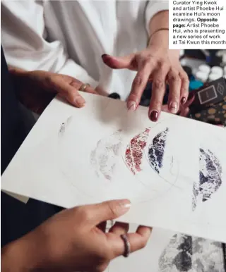  ?? Curator Ying Kwok and artist Phoebe Hui examine Hui’s moon drawings. Opposite page: Artist Phoebe Hui, who is presenting a new series of work at Tai Kwun this month ??