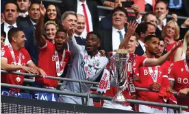  ?? ?? Theodore Theodoridi­s (in white shirt above the cup) and Giorgio Marchetti (to his left) in the dignitarie­s’ seats as Nottingham Forest celebrate. Photograph: Christophe­r Lee/Getty