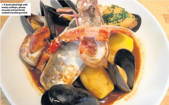  ??  ?? A bowl piled high with meaty scallops, plump mussels and perfectly cooked Cornish gurnard