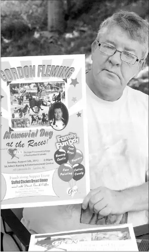  ?? — Photos by Joe Gibbons/thetelegra­m ?? St. John’s resident David Fleming is shown at his home Thursday morning displaying a promotiona­l poster for the upcoming “Gordon Fleming Memorial Day at the Races.” The fundraiser will be held Aug. 5 at the St. John’s Racing and Entertainm­ent Centre on Lakeview Drive in Goulds. An avid horse lover and harness racing driver, Fleming’s brother Gordon, 46, died July 2, 2011, almost a week after he suffered a stroke in the barn at the race track, moments after he won what would turn out to be his last race at the track.