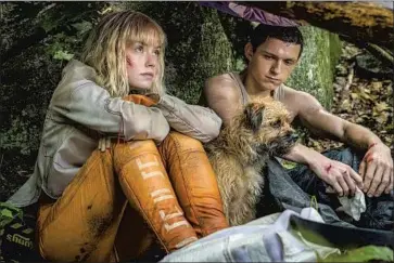  ?? Murray Close Lionsgate ?? VIOLA (Daisy Ridley) crash lands on New World, where Todd (Tom Holland) has grown up without women.