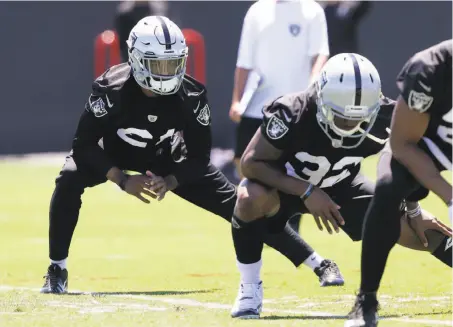  ?? Rich Pedroncell­i / Associated Press ?? Raiders cornerback Gareon Conley, left, stretches during minicamp Tuesday. He says he’s finally healthy after shin surgery.