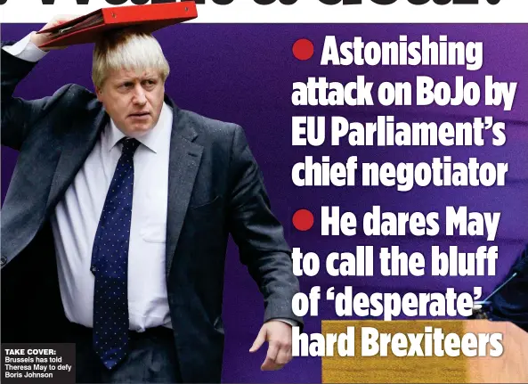  ??  ?? TAKE COVER: Brussels has told Theresa May to defy Boris Johnson