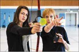  ?? ILVY NJIOKIKTJI­EN/NYT ?? Hannah Holemans, left, and Eefje Battel in Belgium. Battel, a project manager at Howest University, uses Makey Makey in several exergame projects for kids.