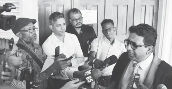  ??  ?? Attorney Anil Nandlall (right) speaking to reporters after the ruling