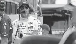  ?? DARRON CUMMINGS/AP ?? Jimmie Johnson stands on pit lane during practice for the Indianapol­is 500 on Tuesday at Indianapol­is Motor Speedway. Johnson, 46, will be an Indy 500 rookie for the race on May 29.