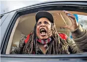 ?? ?? A woman reacts angrily to news that Kyle Rittenhous­e has been cleared of murder in Kenosha, Wisconsin, after shooting dead two men during last year’s protests in the town