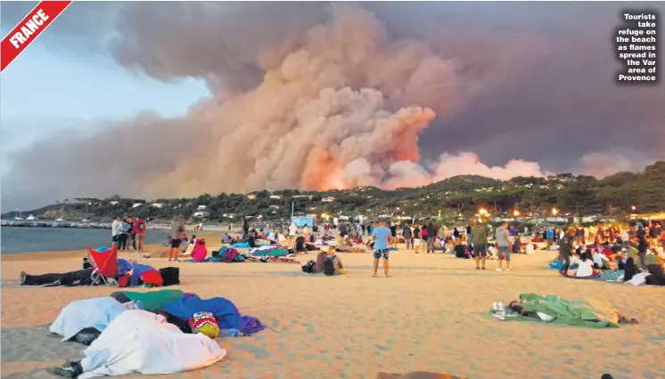  ?? Pictures: EYEVINE, PA, GETTY AND PACIFIC PRESS ?? Tourists take refuge on the beach as flames spread in the Var area of Provence