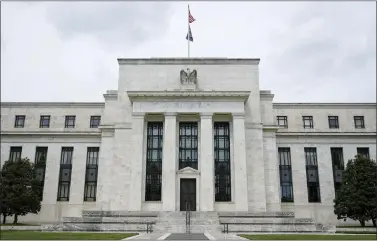  ?? PATRICK SEMANSKY — THE ASSOCIATED PRESS FILE ?? The Federal Reserve began unleashing its most drastic steps in three decades to attack inflation by making it costlier to borrow, compoundin­g financial strains on Americans and likely weakening the economy.