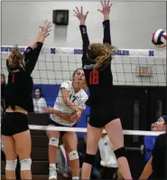  ?? BARRY TAGLIEBER — FOR MEDIANEWS GROUP ?? Pope John Paul II’s Sarah Ward hits past Boyertown’s Jess Ahart and Adrianna Derstine.