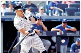  ?? Jason Szenes ?? A LITTLE BIT BETTER: Giancarlo Stanton lashes an RBI single in the eighth inning. Stanton entered the day hitting .109 since his return from the injured list earlier this month.