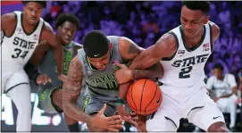  ?? TIM AYLEN — BAHAMAS VISUAL SERVICES VIA AP ?? Baylor guard James Akinjo (11) and Michigan State guard Tyson Walker (2) battle for the ball during Friday’s game at Paradise Island, Bahamas.