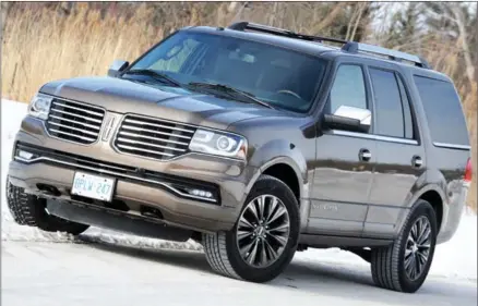  ??  ?? The 2015 Lincoln Navigator, seen here in a new shade of Java Metallic, refreshed inside and out, loaded with new standard equipment and instrument­ation, and boasting new EPAS steering, a new suspension technology and a new turbocharg­ed EcoBoost V6...