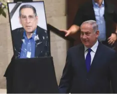  ??  ?? PRIME MINISTER Benjamin Netanyahu attends the Knesset session in memory of slain tourism minister Rehavam Ze’evi yesterday.