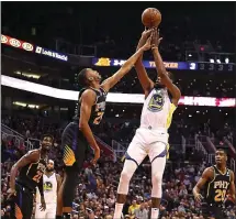  ?? CHRISTIAN PETERSEN — GETTY IMAGES ?? The Warriors’ Kevin Durant (35) scored 21 points in Friday’s 117-107 victory over the Phoenix Suns.