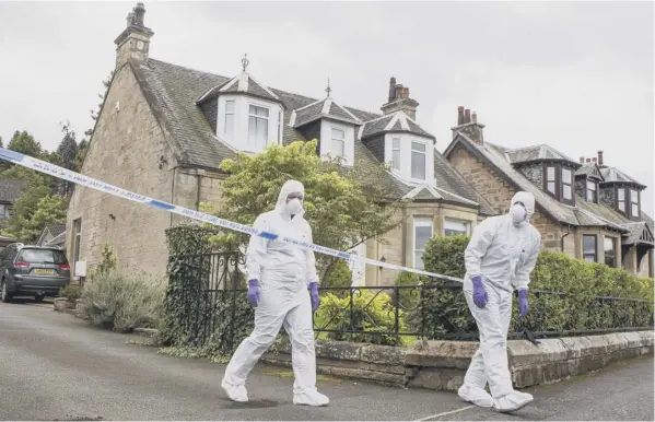  ??  ?? 0 Forensics officers outside the house in Bo’ness where 64-year-old Arnold Mouat’s body was found, four weeks after he was reported missing