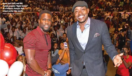  ?? PARAS GRIFFIN/GETTY IMAGES ?? Kevin Hart (left) and Will Packer promote “Night School” at a Fairburn, Georgia, high school earlier this month.
