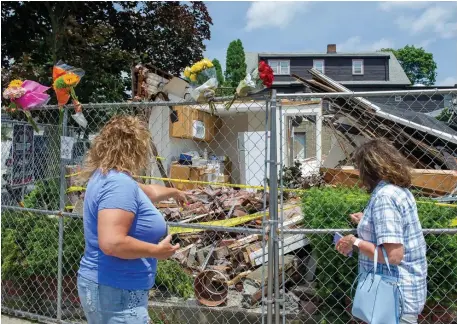  ?? AMaNDa saBga pHOTOs / BOsTON HeralD ?? EYEING THE AFTERMATH: Michelle Navarro and Diann Anzalone talk about the events that occurred at the scene of a truck crash that began a chaotic series of events Saturday leaving three people dead including the shooter in Winthrop.