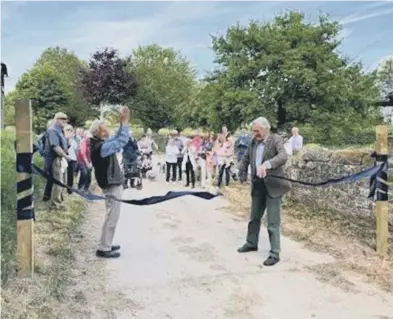  ?? ?? Lord Egremont officially opens the path