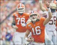  ?? RICHARD SHIRO — THE ASSOCIATED PRESS ?? Clemson quarterbac­k Trevor Lawrence reacts after scoring a touchdown Oct. 12, 2019, against Florida State in