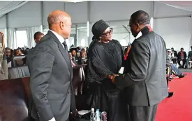  ?? ?? President Mnangagwa consoles President Hage Geingob’s widow Madame Monica Geingos while his successor President Nangolo Mumba looks on during a church service at the Independen­ce Stadium in Windhoek, Namibia, yesterday